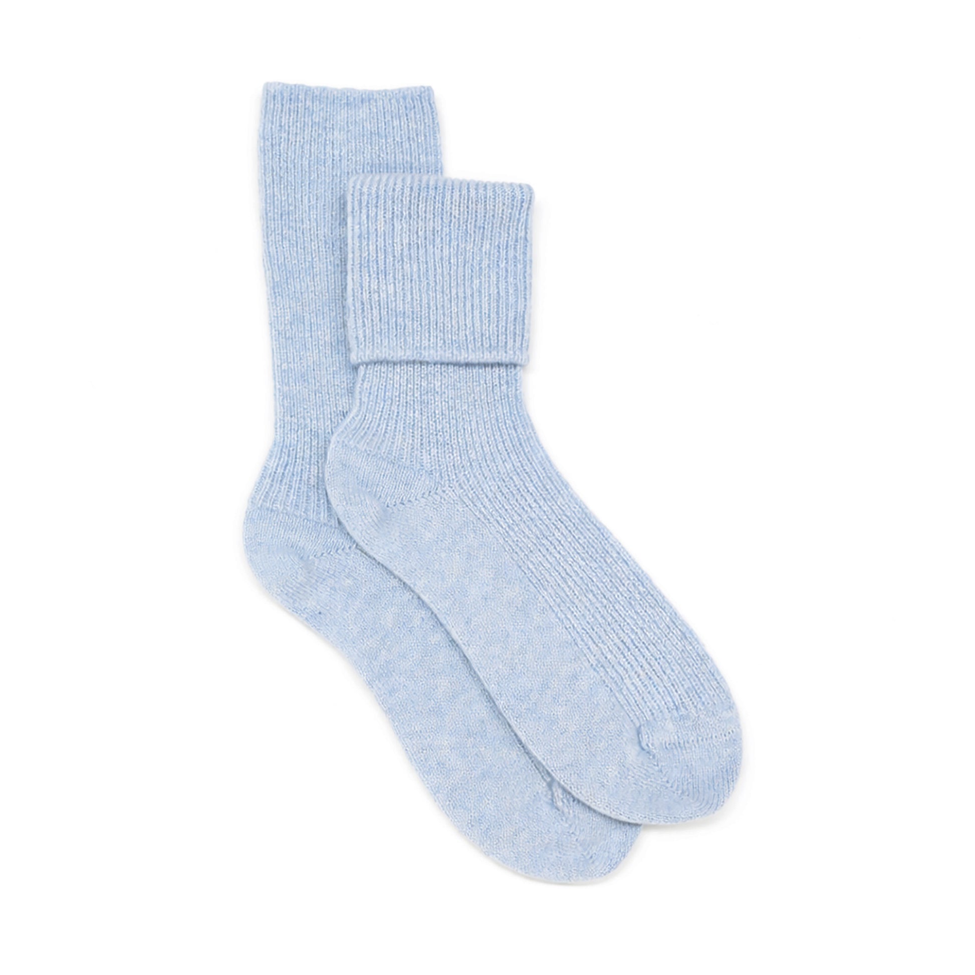 Pair of light blue Cashmere Bed socks on a white background