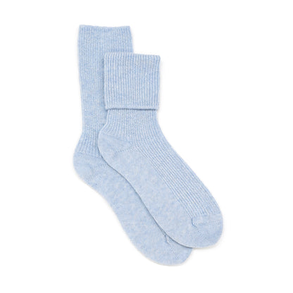Pair of light blue Cashmere Bed socks on a white background