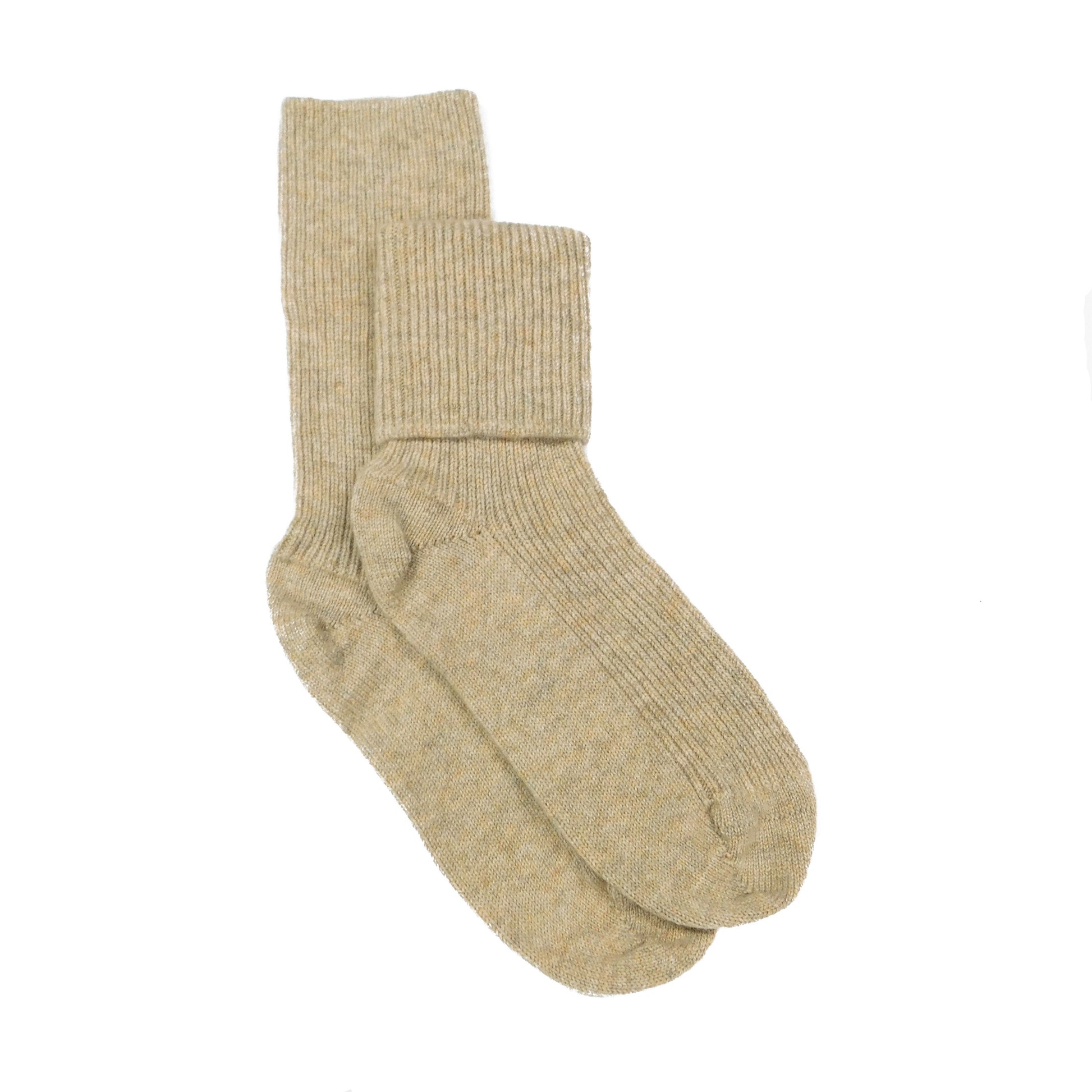 Pair of beige cashmere bed socks on a white background